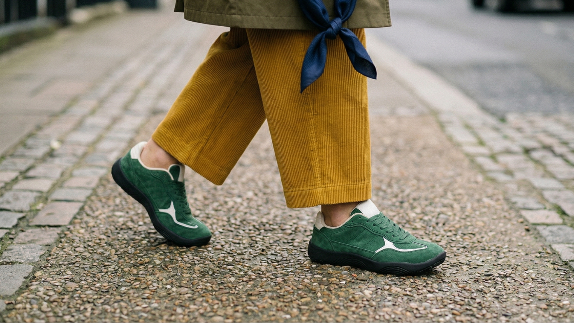 Green mumei wide toe box shoes worn on a street